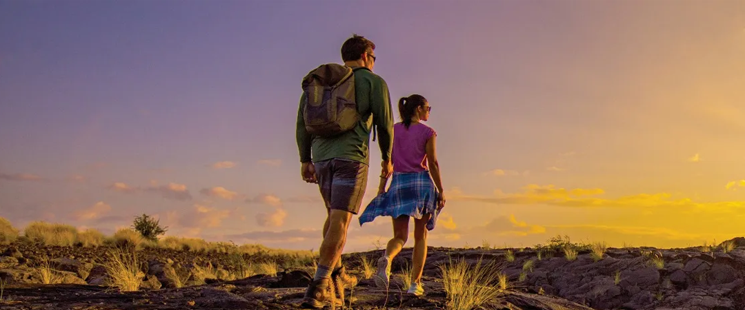 male and female hiking wearing maui jim sunglasses