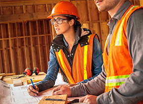 person wearing hard hat and safety glassess