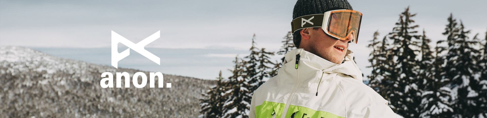 anon goggles banner with guy wearing anon goggles on face in the mountains