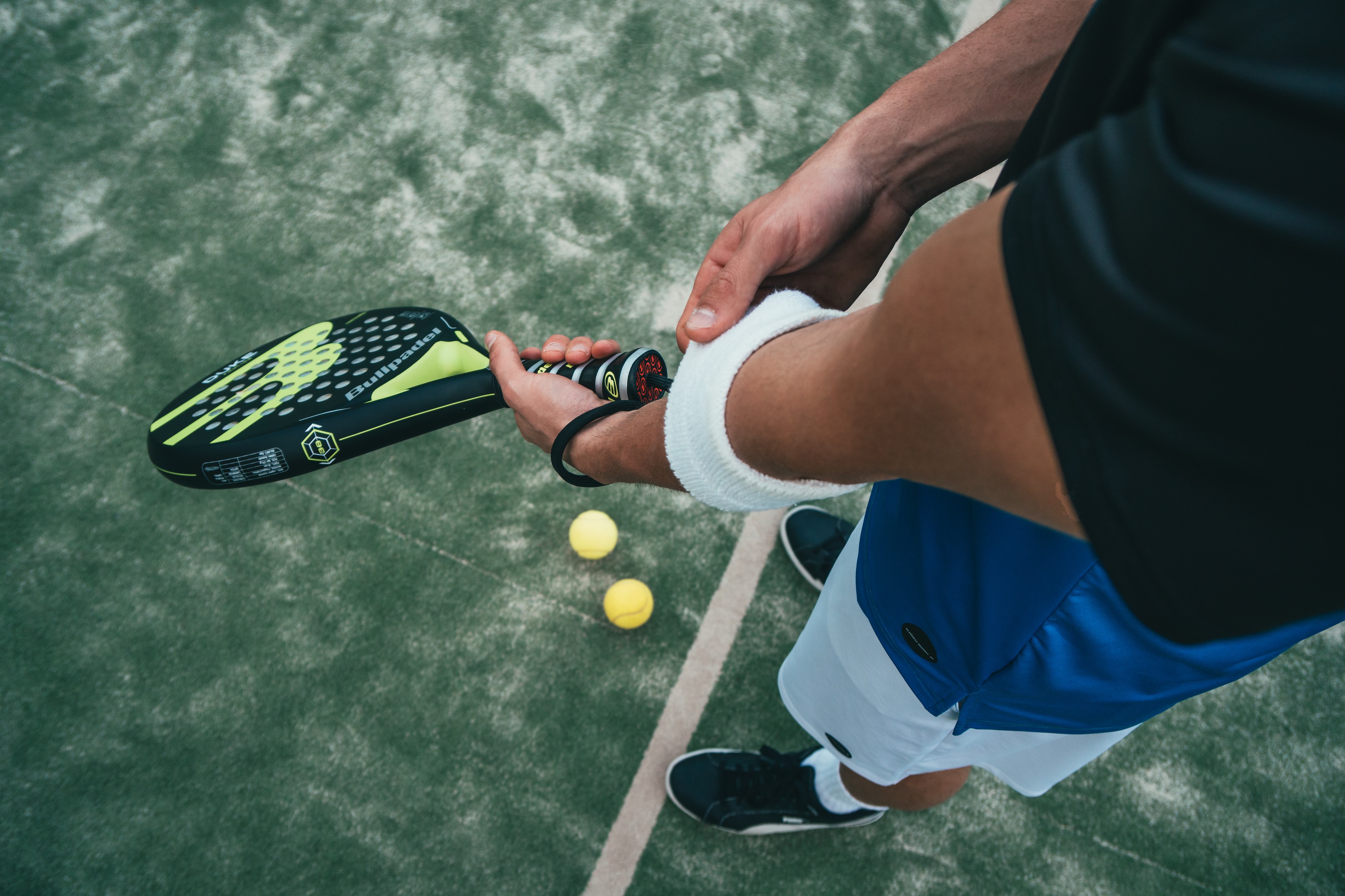 man holding tennis racket