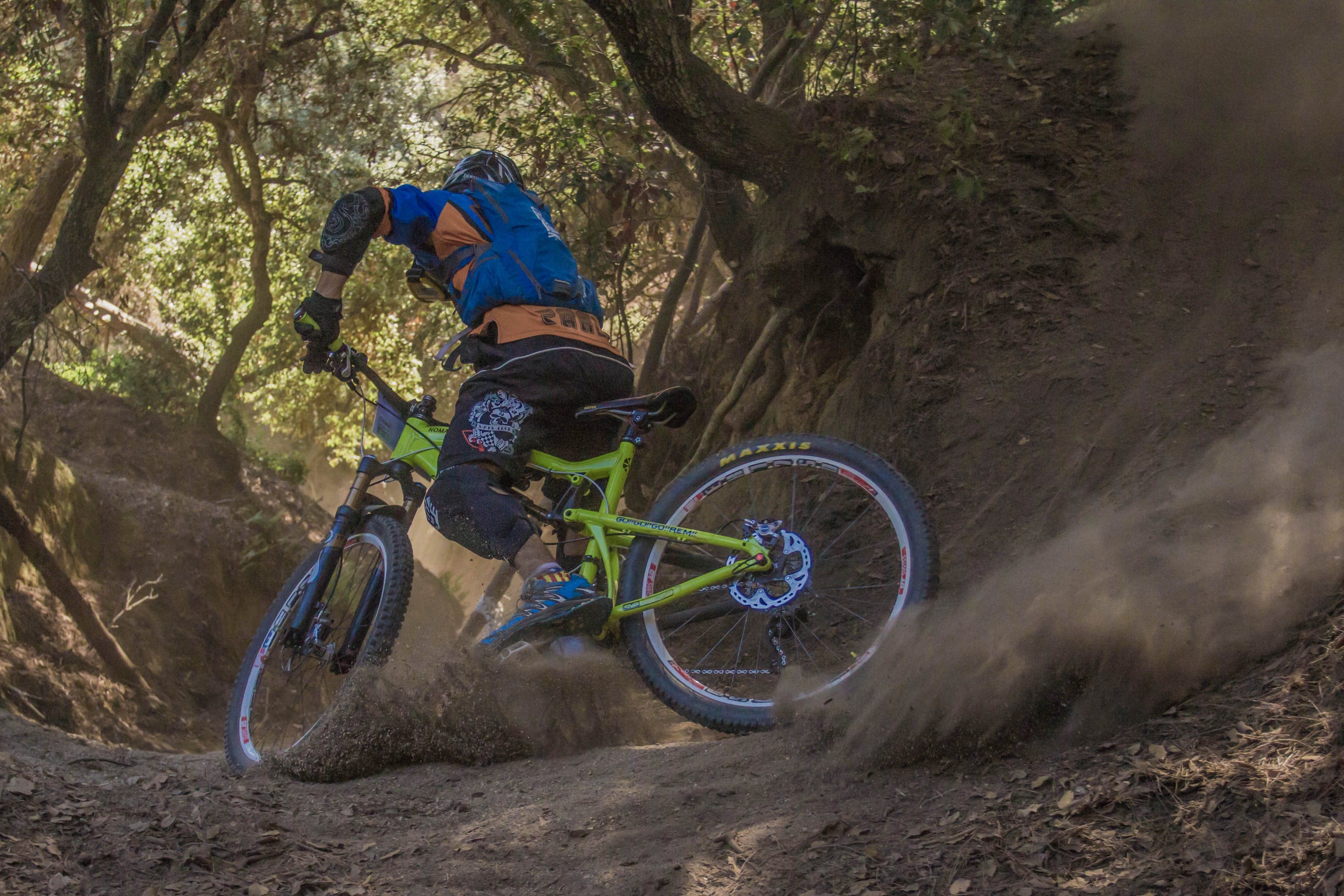 man riding with green off road bike