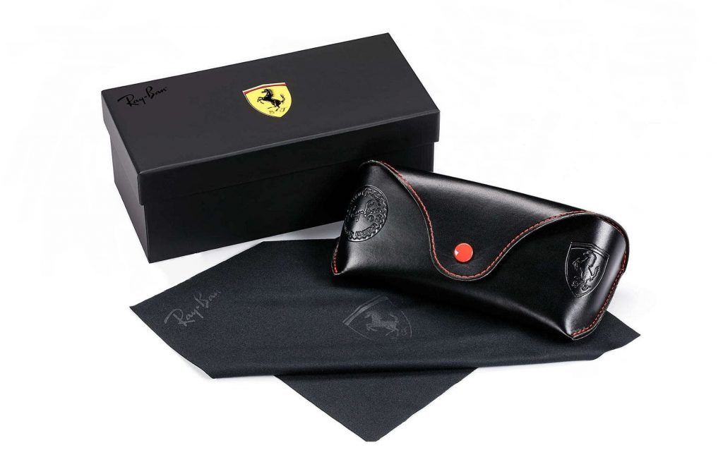 ray ban scuderia ferrari special packaging featuring 1 box, 1 case, and 1 cleaning cloth in black with ray ban & ferrari logo
